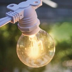 BLOWOUT 50 Socket Outdoor Commercial String Light Set, Clear Globe Bulbs, 54 FT White Cord W/ E12 C7 Base, Weatherproof 16 BLOWOUT 50 Socket Outdoor Commercial String Light Set, Clear Globe Bulbs, 54 FT White Cord W/ E12 C7 Base, Weatherproof -Lights Decor Shop 50 socket outdoor patio string light g40 white image 1 1e6313bb 6d05 4891 8e01 bfa70884f6bd